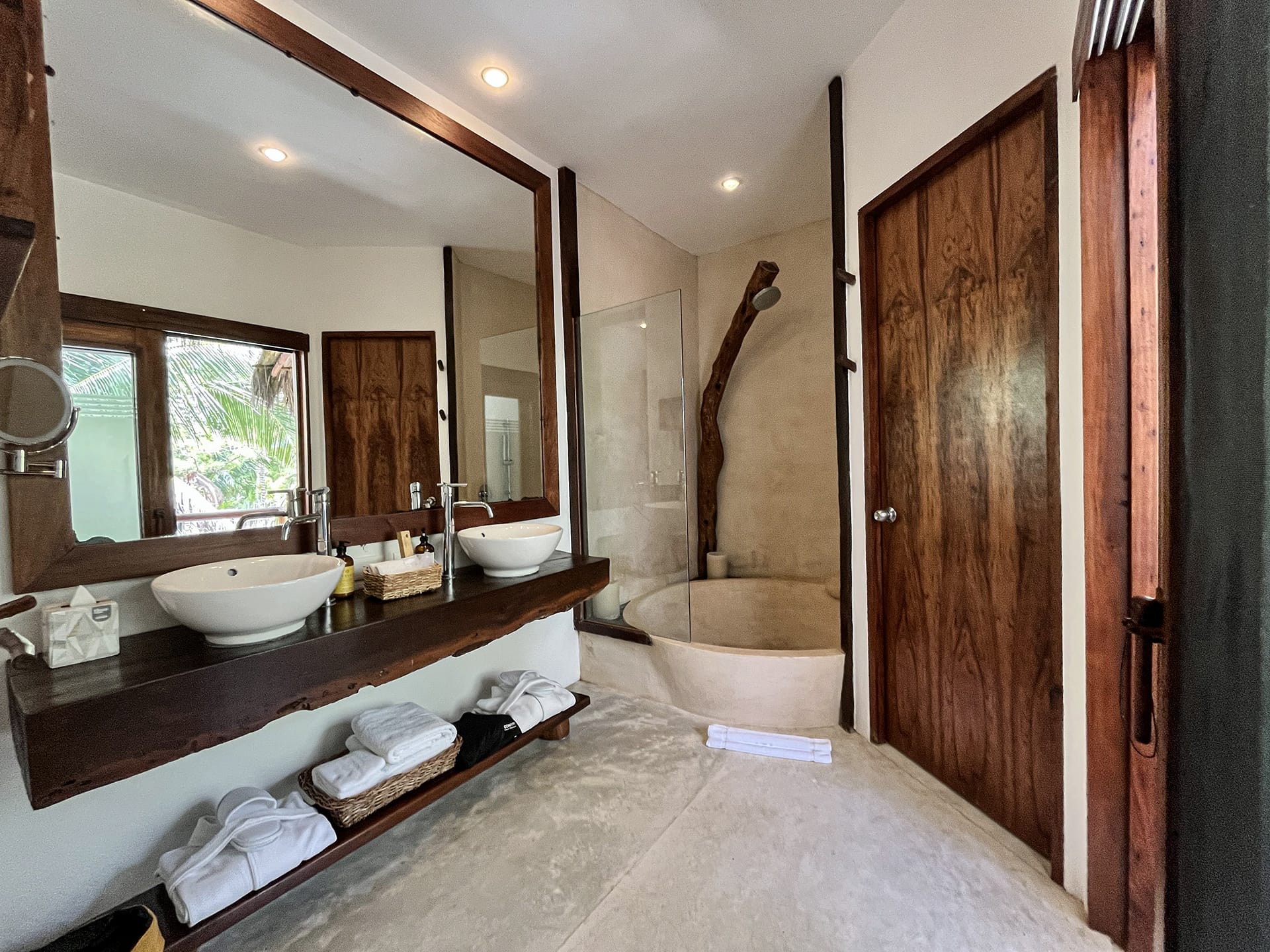 Rooftop room bathroom with round shower at The beach tulum Hotel